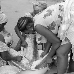 Women Grating Coconut
