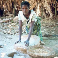 Lamba Village Woman Grinding Sorghum into Flour