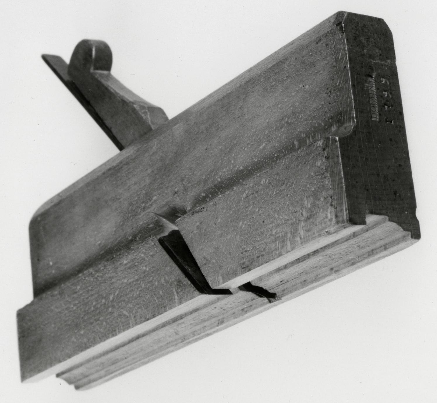 Black and white photo of a sash plane, or rabbet and ovolo.
