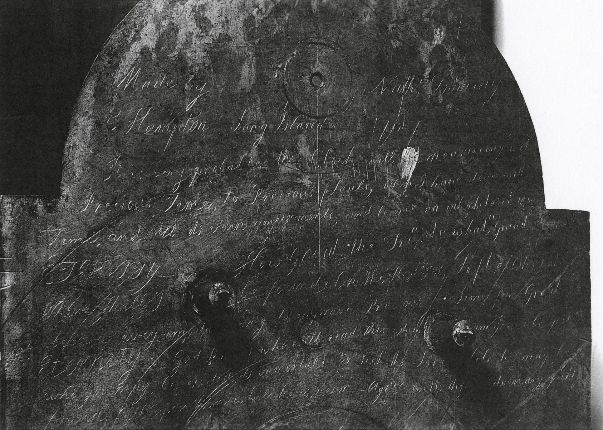 Black and white photograph of the inscription on the back of the clock.