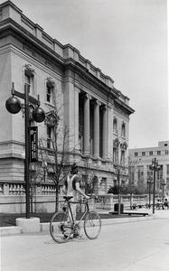 Student and bike outside State Historical Society