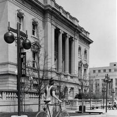 Student and bike outside State Historical Society