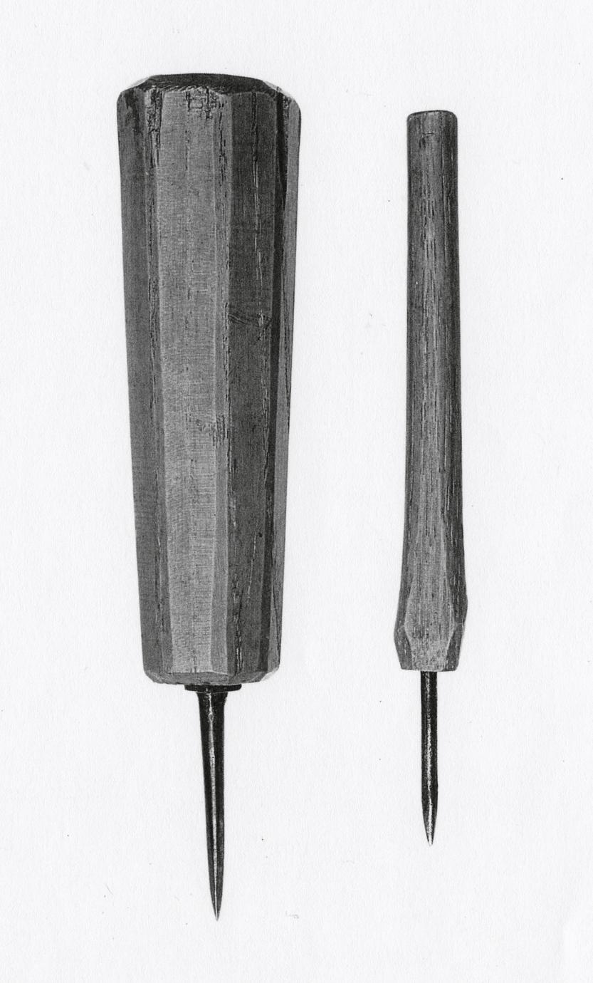 Black and white image of two bradawls, one larger and one smaller.