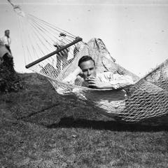 Young man smoking in hammock