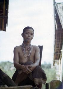 A Nyaheun woman smokes her tobacco pipe in Attapu Province