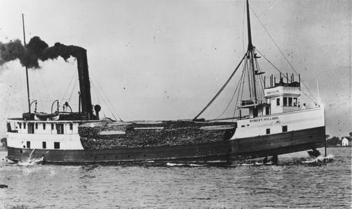 The Robert Holland with deck loaded with logs