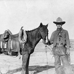 Standing with horse, Arizona, 1911