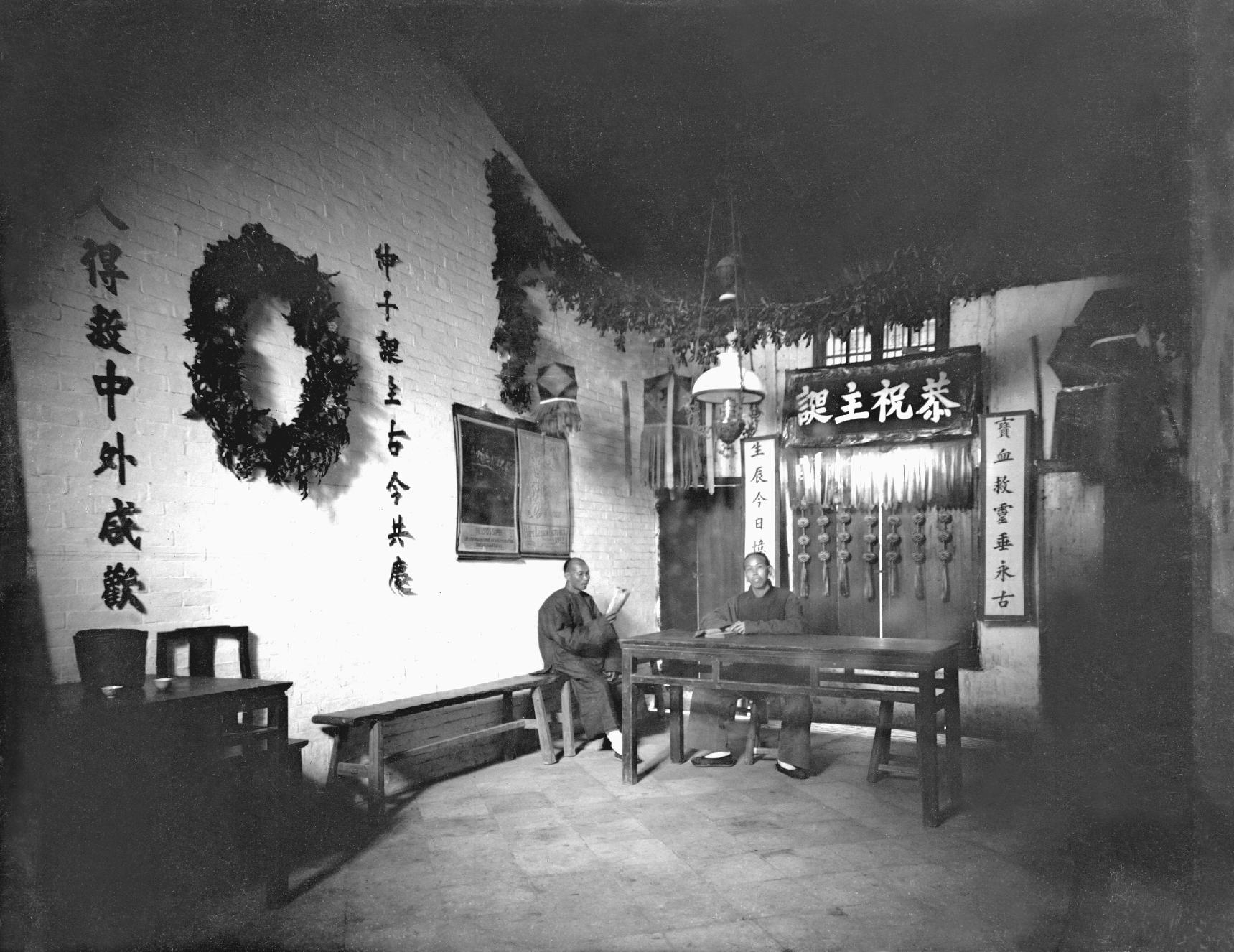 Doctor Patton and an elder, inside the old chapel at Yeungkong 陽江.