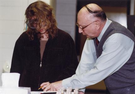 Emeritus Chemistry professor Joe Diamanti working with student