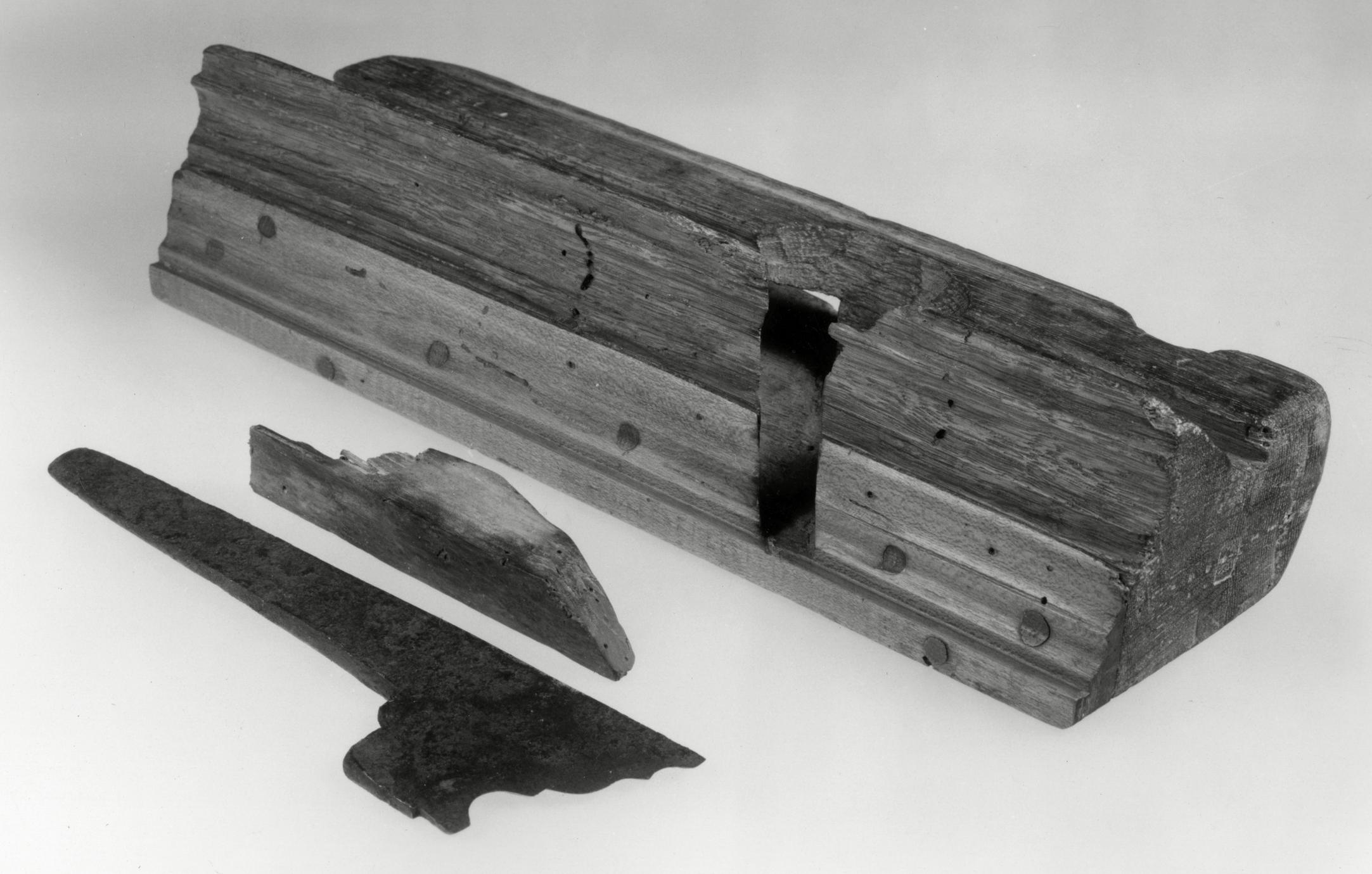 Black and white photograph of a molding plane.