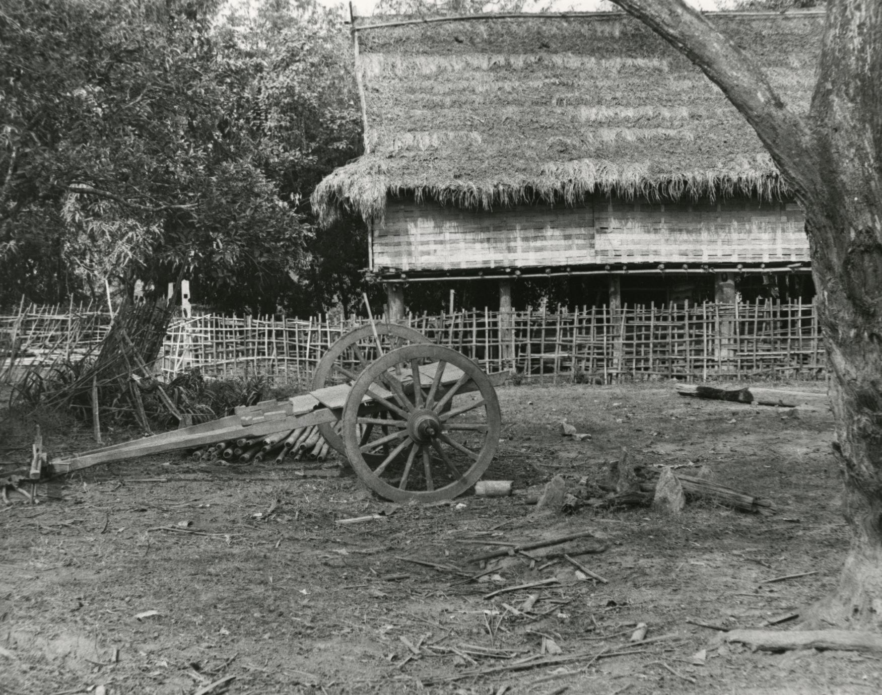 Typical Lu house with cart in Houa Khong Province