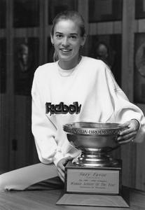 Suzy Favor Hamilton holds the Honda-Broderick Cup Trophy