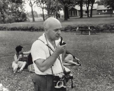 William Hesseltine with pipe and camera