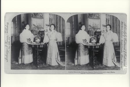 Young Spanish mestizo women in native dress inside a home, Manila, 1899