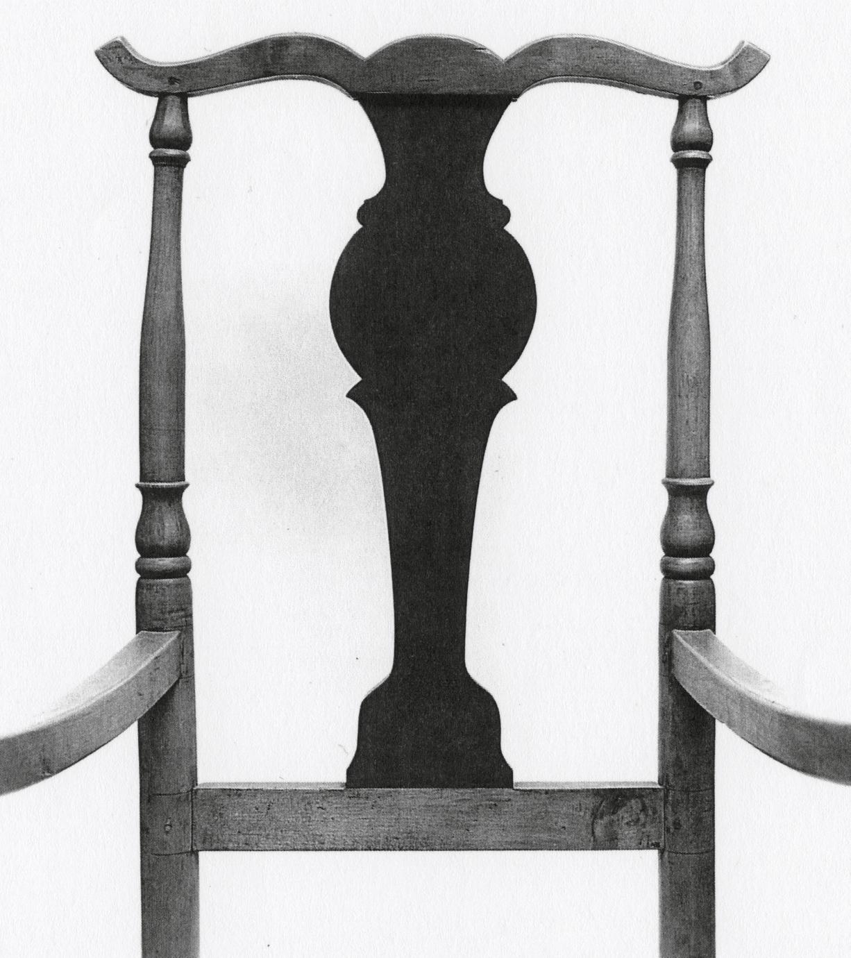 Black and white photograph of a fiddle-back armchair with rockers.