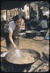 Woman stirring stew