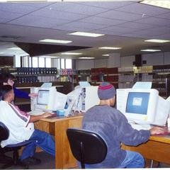 Students utilizing computers in library