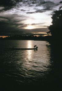 Boat on Ogooue River at Sunset