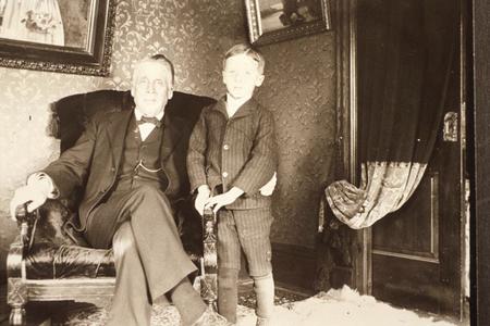 Father and son in the parlor of their Montello, Wisconsin, home.