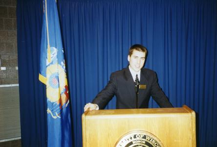 Stout Student Association, Ted Krez standing at podium