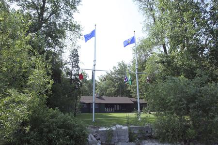 Flagpoles in front of Lambeau Cottage