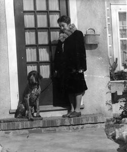 Estella Bergere Leopold with dog in front of 2222 Van Hise