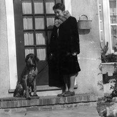 Estella Bergere Leopold with dog in front of 2222 Van Hise