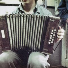 Matthew Gallmann holds Matti Pelto's button accordion