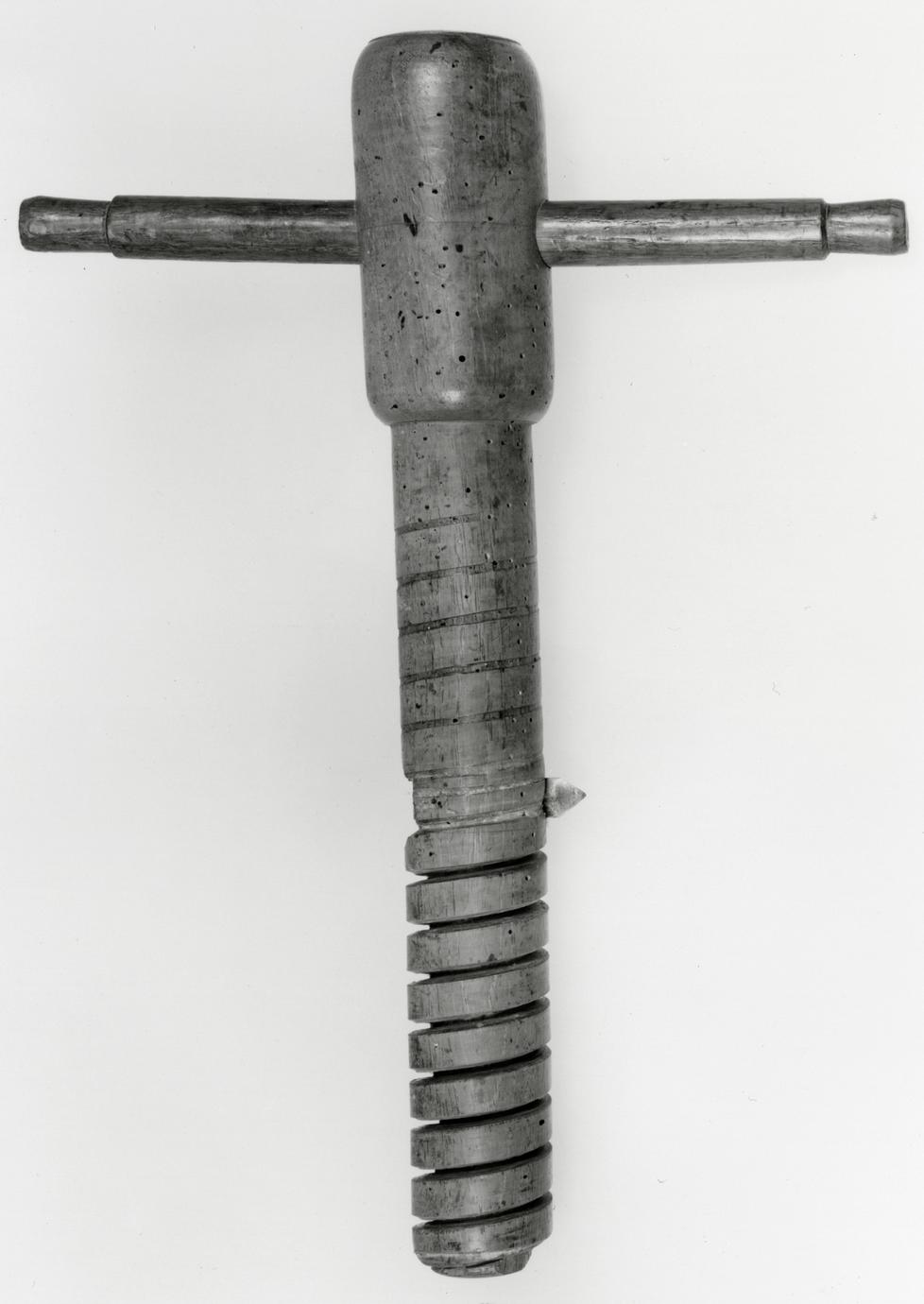 Black and white photograph of a wooden screw tap.