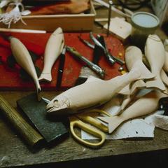 John Snow's carved wooden fish decoys on workshop bench