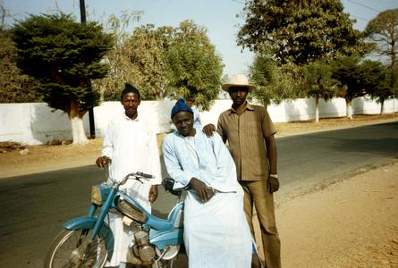 Men with a Mobylette (Moped), a Popular Means of Transportation