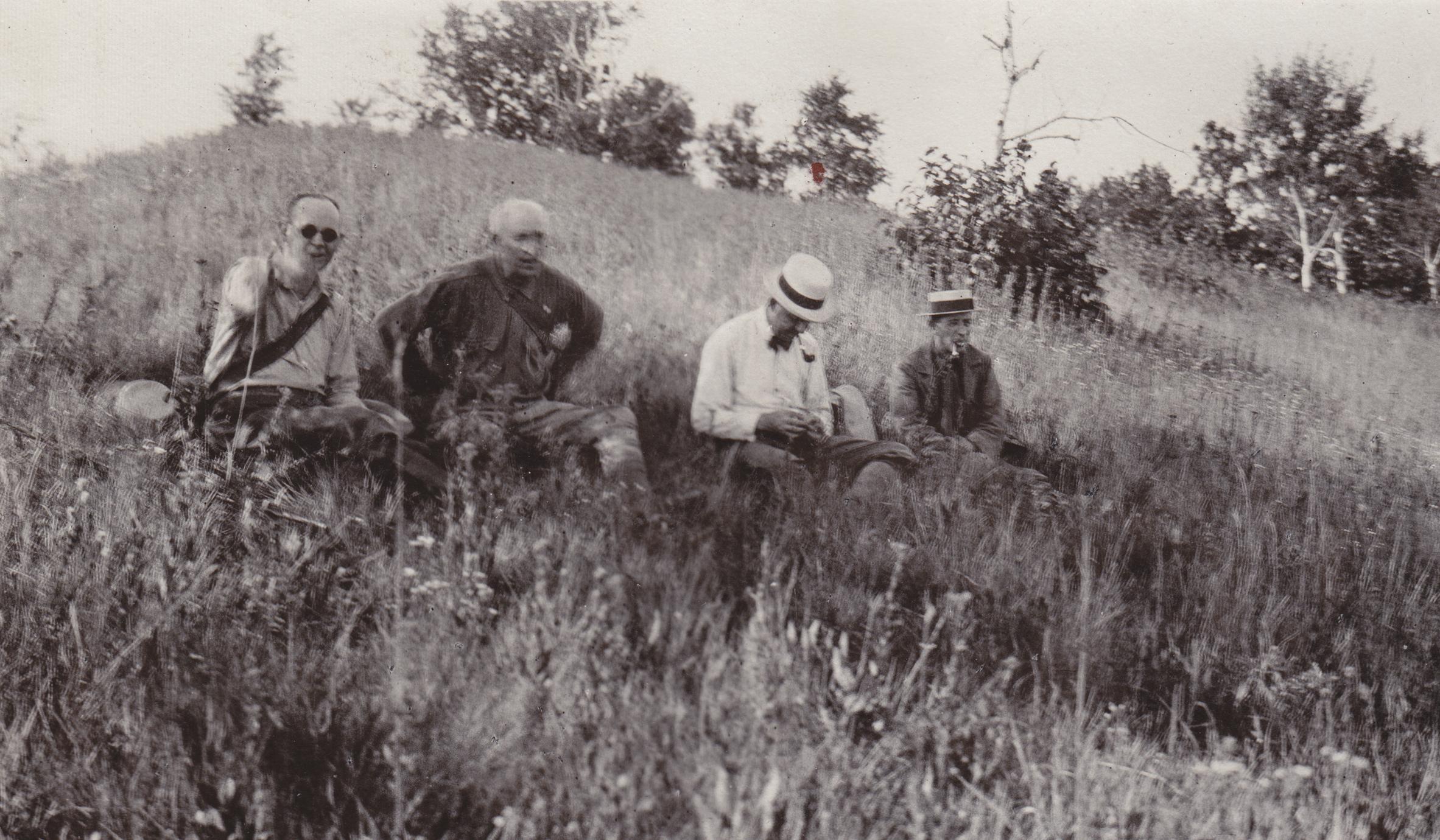 Geologists resting on bluff