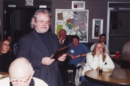 Theatre professor Brad Ford speaking in cafeteria