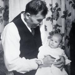 Franz Hacker holds grandchild