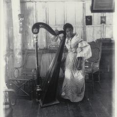 Native girl and harp, Corregidor, 1900-1901