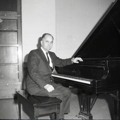 Dr. John Webb at piano