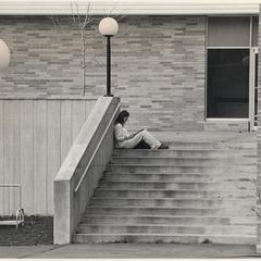 UW Marathon County student studying on steps