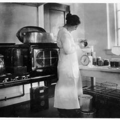 Student performing experiment with canned foods