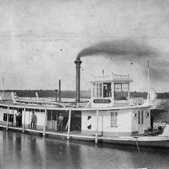 Side view of the Marion tied up in a canal