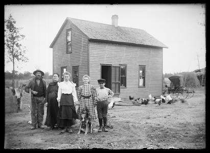 Family group, rural farm yard