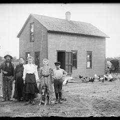 Family group, rural farm yard