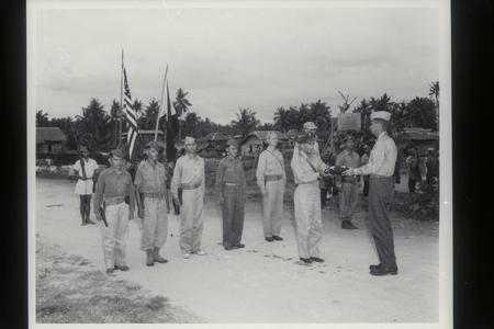 Presenting flags to guerrillas, Mindanao, 1945