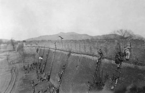 Chinese troops scale a fortress wall.