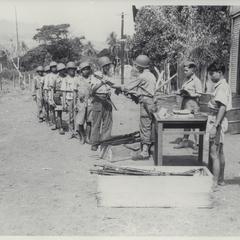 Guerrillas being issued rifles, Mindanao, 1945