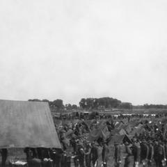 Soldiers of the US Army's 15th Infantry Regiment line up in front of the base canteen.