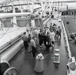 Students and professor on a ship.