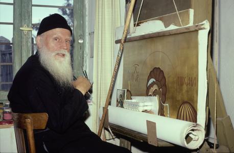Father Maximos painting an icon