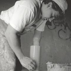 Art student working with potter's wheel