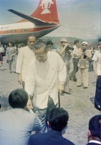 Prince Souvanna Phouma is greeted by local officials at the Luang Prabang airport