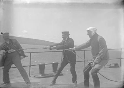 Group of Three Men on Shipboard